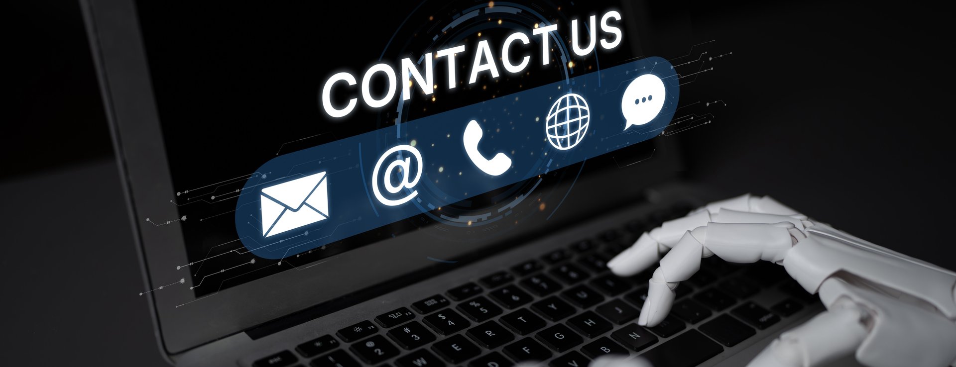 Contact Us graphic with email, phone, web and chat icons over a laptop keyboard